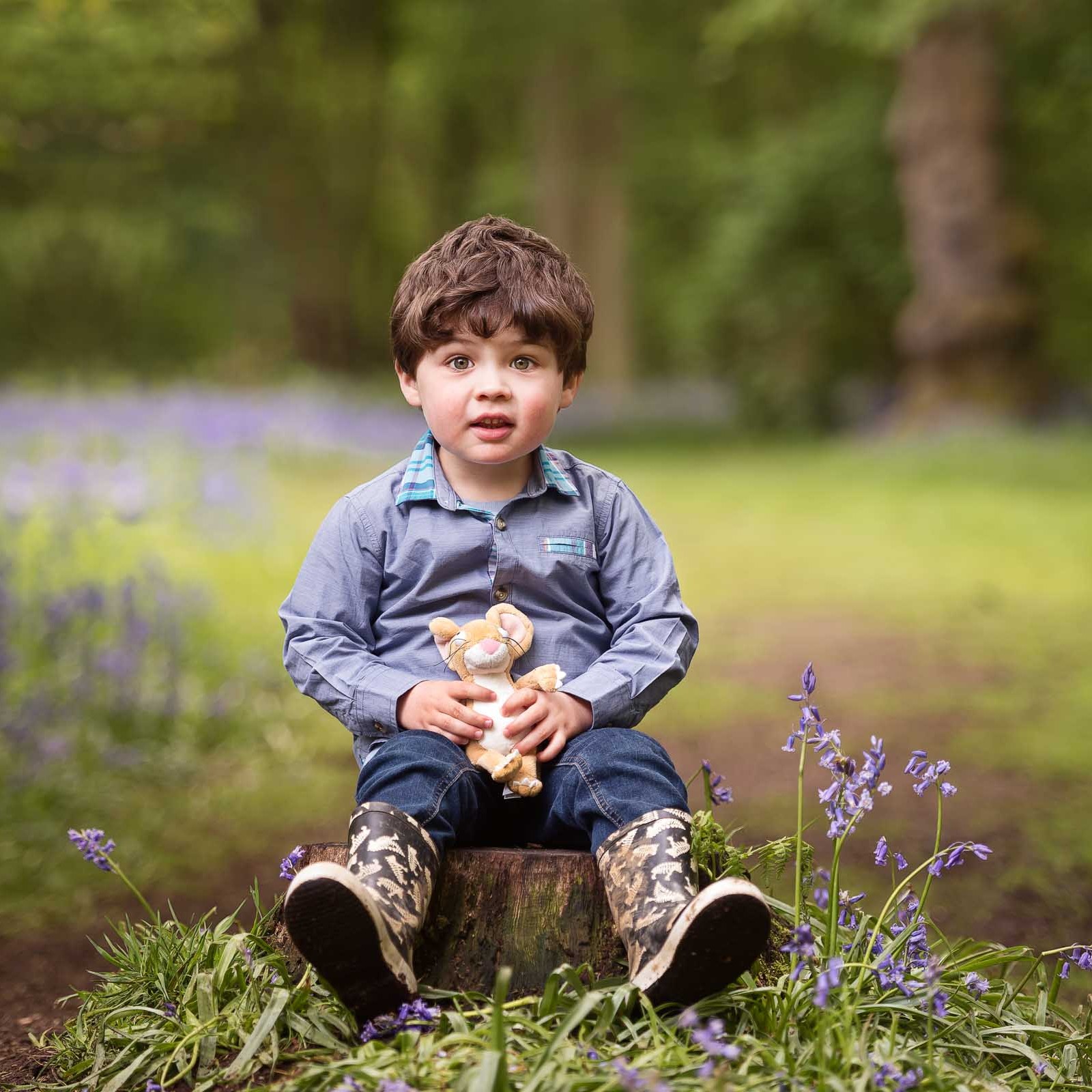 Little boy holding a Gruffalo toy at a Spring Photo Shoot