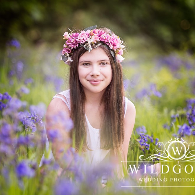 Bluebell Photoshoot in Northamptonshire woodland with pretty girl in a pink flower crown